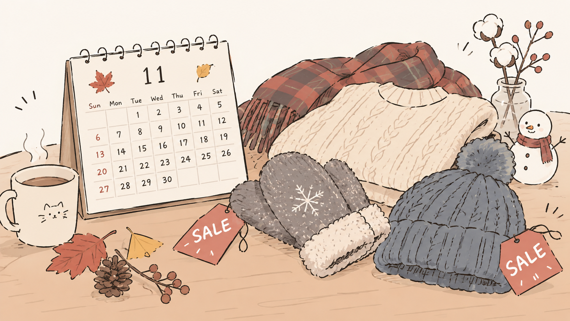 11月のカレンダーとセールタグ、冬の防寒グッズが並ぶテーブル